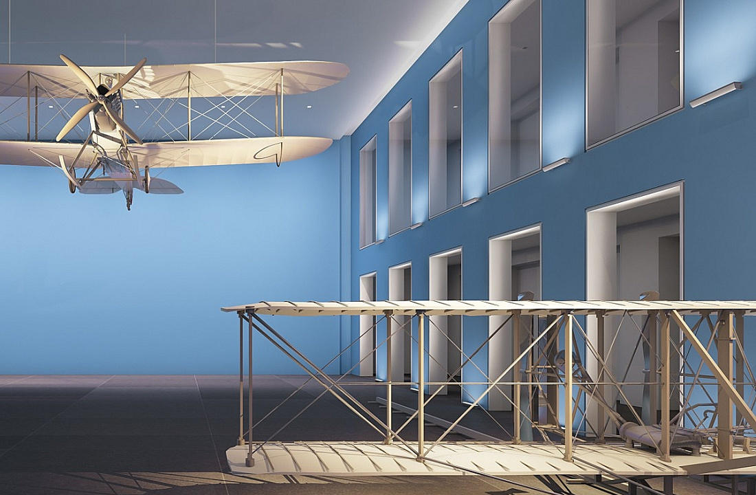 Exhibition featuring a vintage airplane model, illuminated with ERCO lighting for atmospheric effect.