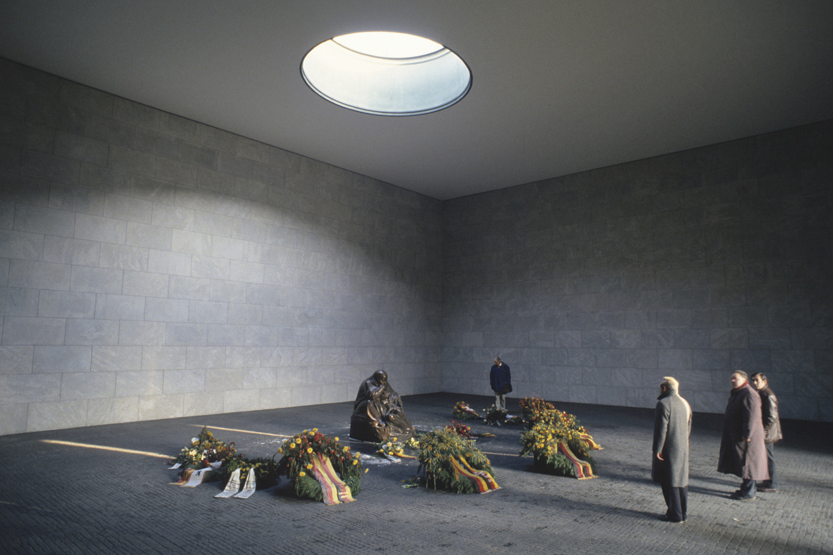 Interior of Neue Wache in Berlin, featuring sculpture and daylight, a place for contemplation and remembrance.