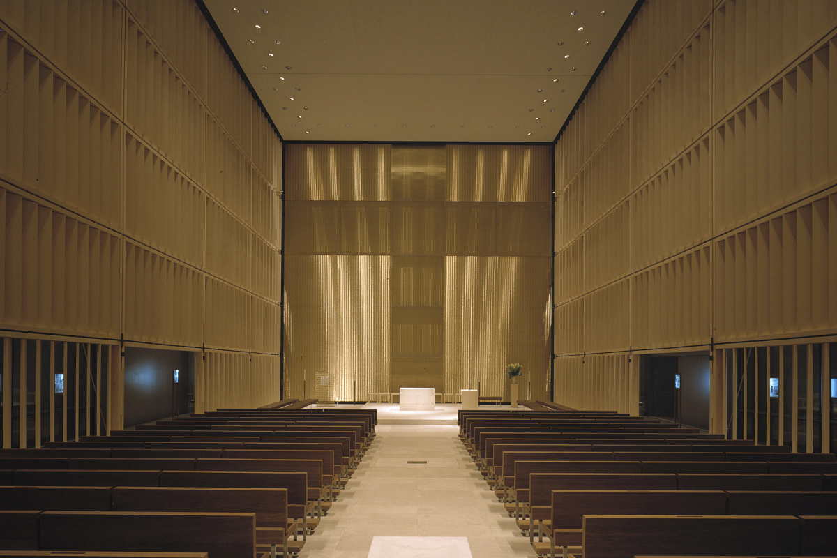 Church interior featuring pews and altar, illuminated with ERCO lighting for sacral buildings.