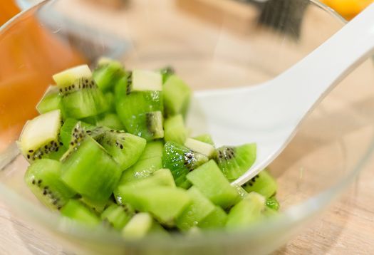 Diced kiwi in a bowl, part of a healthy meal at Youfresh, Berlin.