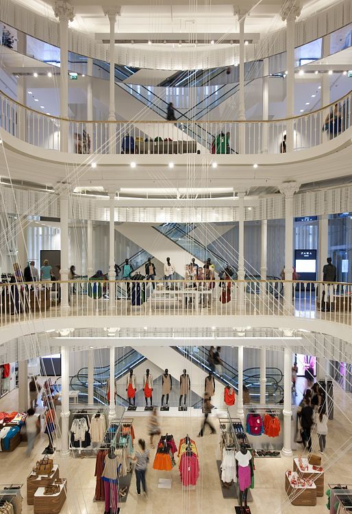 Multi-level ZARA store in Rome featuring ERCO lighting for vertical product presentation.